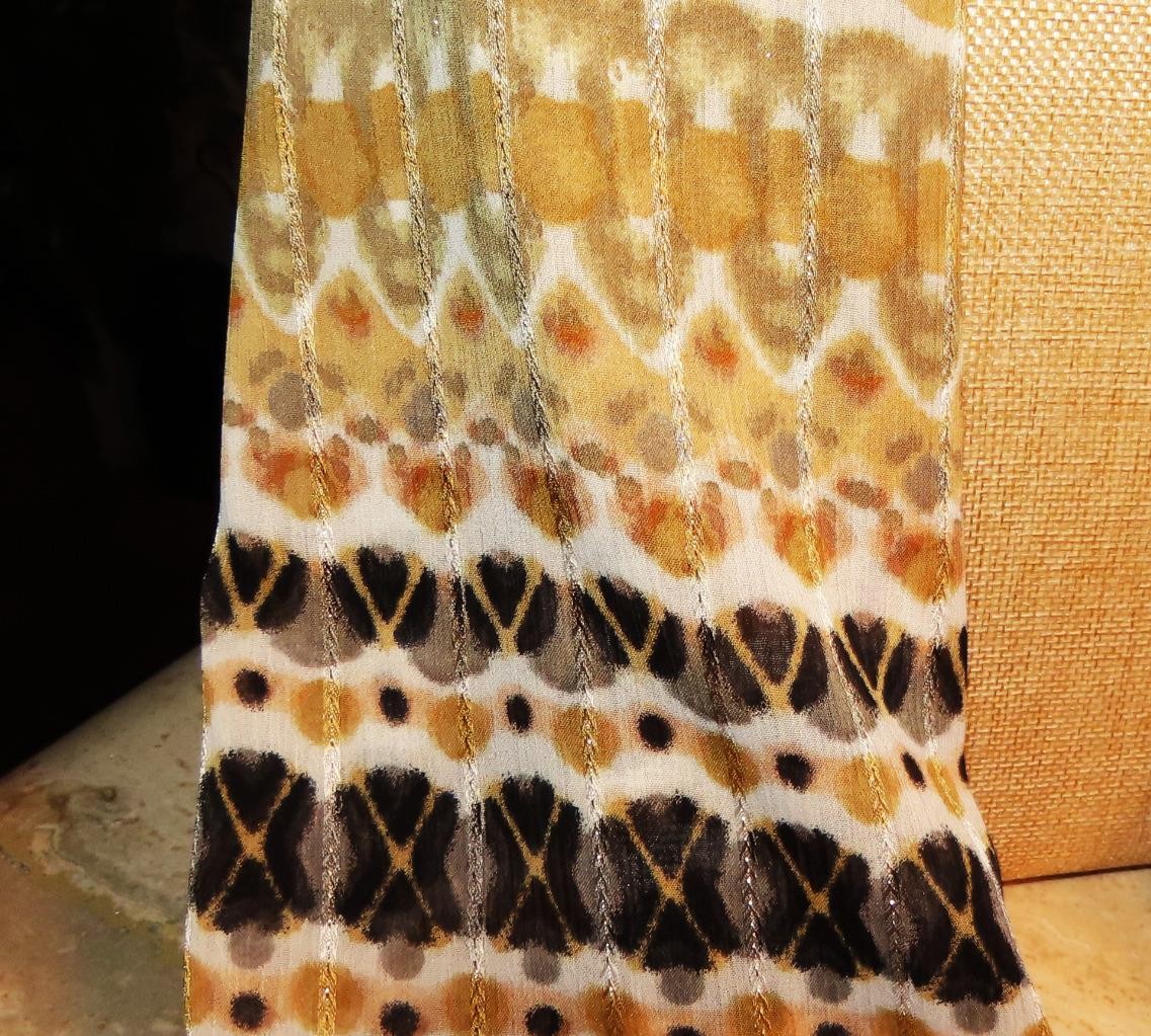 Echo oblong scarf; abstract; tan white black; metallic accents; poly; 72x20 in.