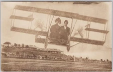 Early Biplane Studio Novelty Man Woman Couple in Cockpit RPPC Postcard H79