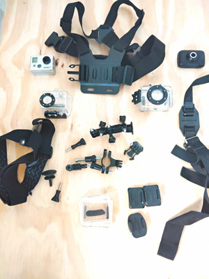 GoPro HERO2 and a Sharper Image video action camera and accessories 