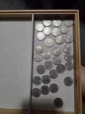 Tokens for arcades and amusement machines, typically in the 1960s and 1970s. 