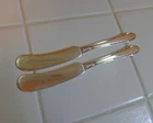 2 International Sterling Silver Enchantress Butter Spreaders Flat Handle 5 5/8"