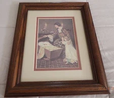  PRINT OF MOTHER, DAUGHTER AND BABY IN CRADLE - MATTED WOODEN FRAME UNDER GLASS