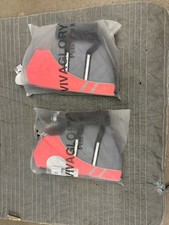 Two dog life jackets and four boots