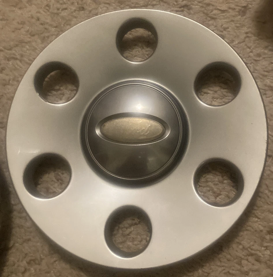 Juego tapacubos central satinado platino Ford F-150 Expedition 2007-2011 7L14-1A096-EB Foto 2 de 4