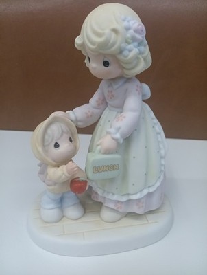 Precious Moments figurine titled ''Cherishing Each Special Moment. C79