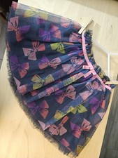 Cherokee multicoloured Tutu with pink ribbon. Childs size 5.