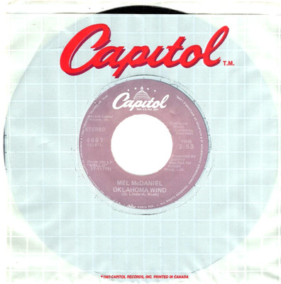 Mel McDaniel:   Oklahoma Wind / Love Lies ''IMPORT'' 45 RPM 10553