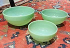 A set of three vintage Fire King Jadeite mixing bowls