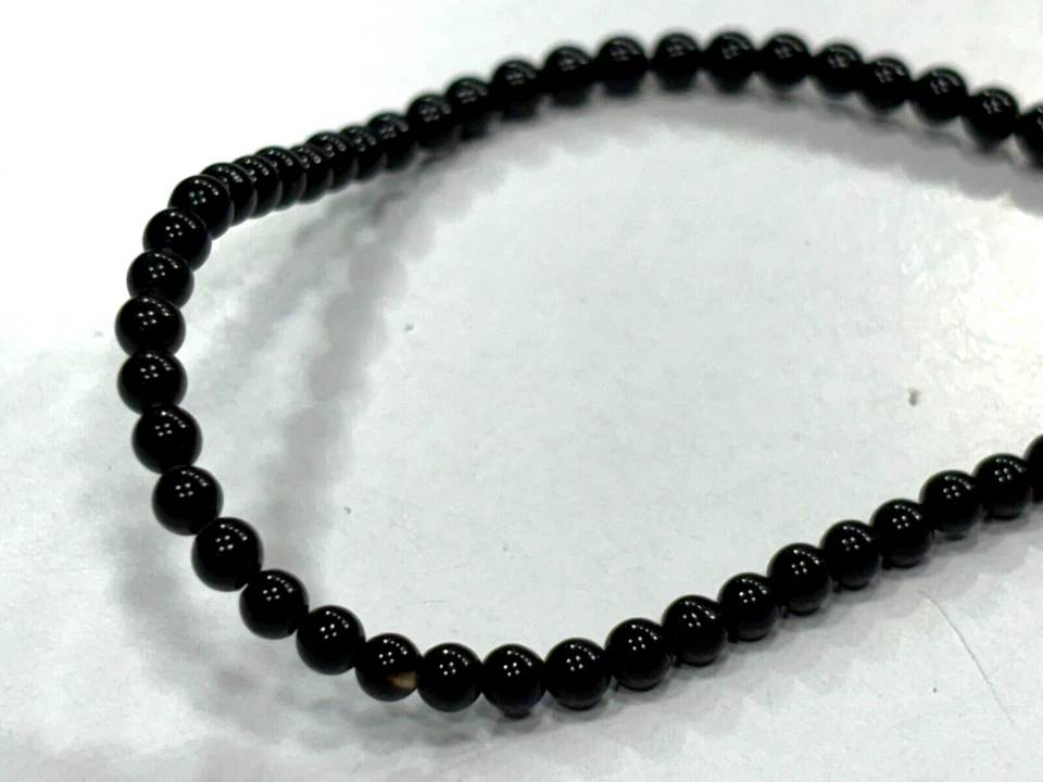 CUENTAS DE PIEDRAS PRECIOSAS REDONDAS LISAS DE ÓNIX NEGRO DE 3-3,5 MM 1 HEBRA 14 PULGADAS Foto 4 de 4
