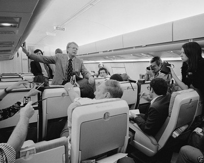 Jimmy Carter holds a press conference aboard his campaign plane - New 8x10 Photo