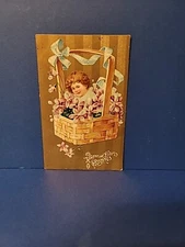 Antique 1910 VALENTINE Greeti Postcard Child In Basket Full Lilacs Embossed