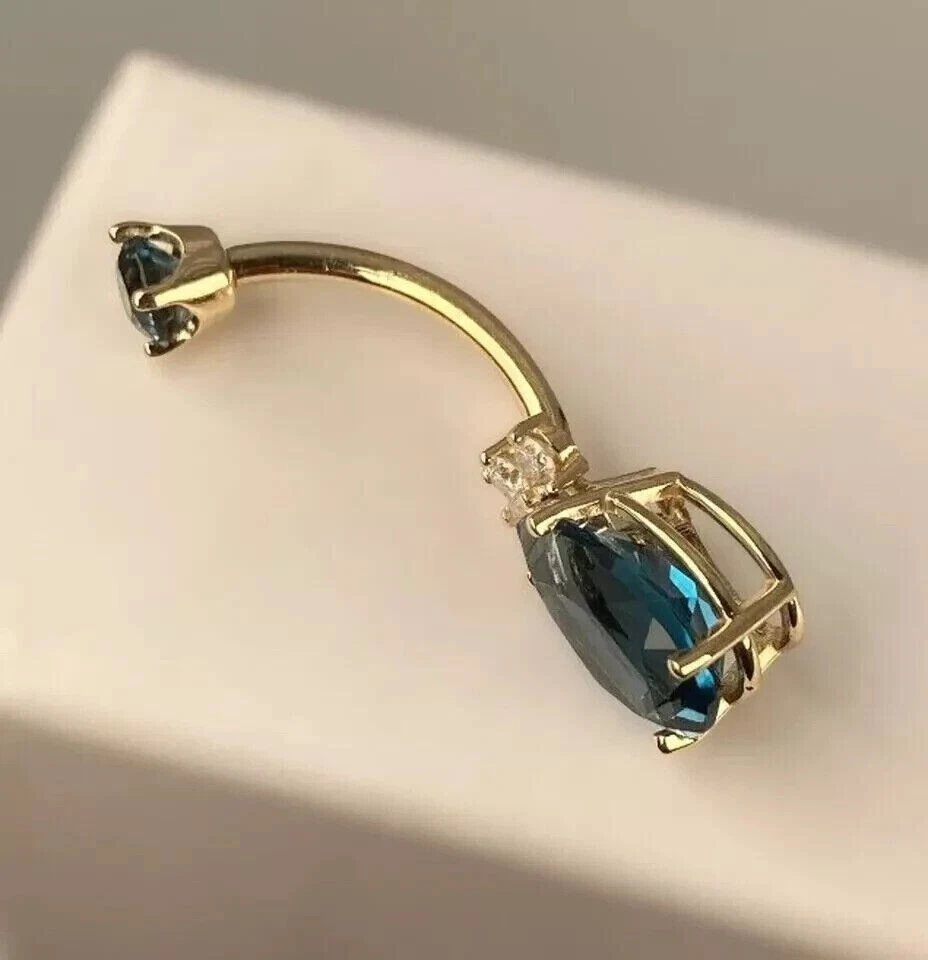 Anillo ombligo topacio azul creado en laboratorio de pera de 2 quilates enchapado en oro amarillo de 14 k Foto 4 de 4