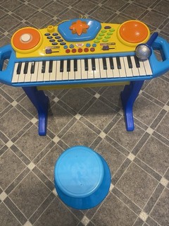 Child’s Battery operated Piano with Microphone and Stool . Piano height 19 ins.
