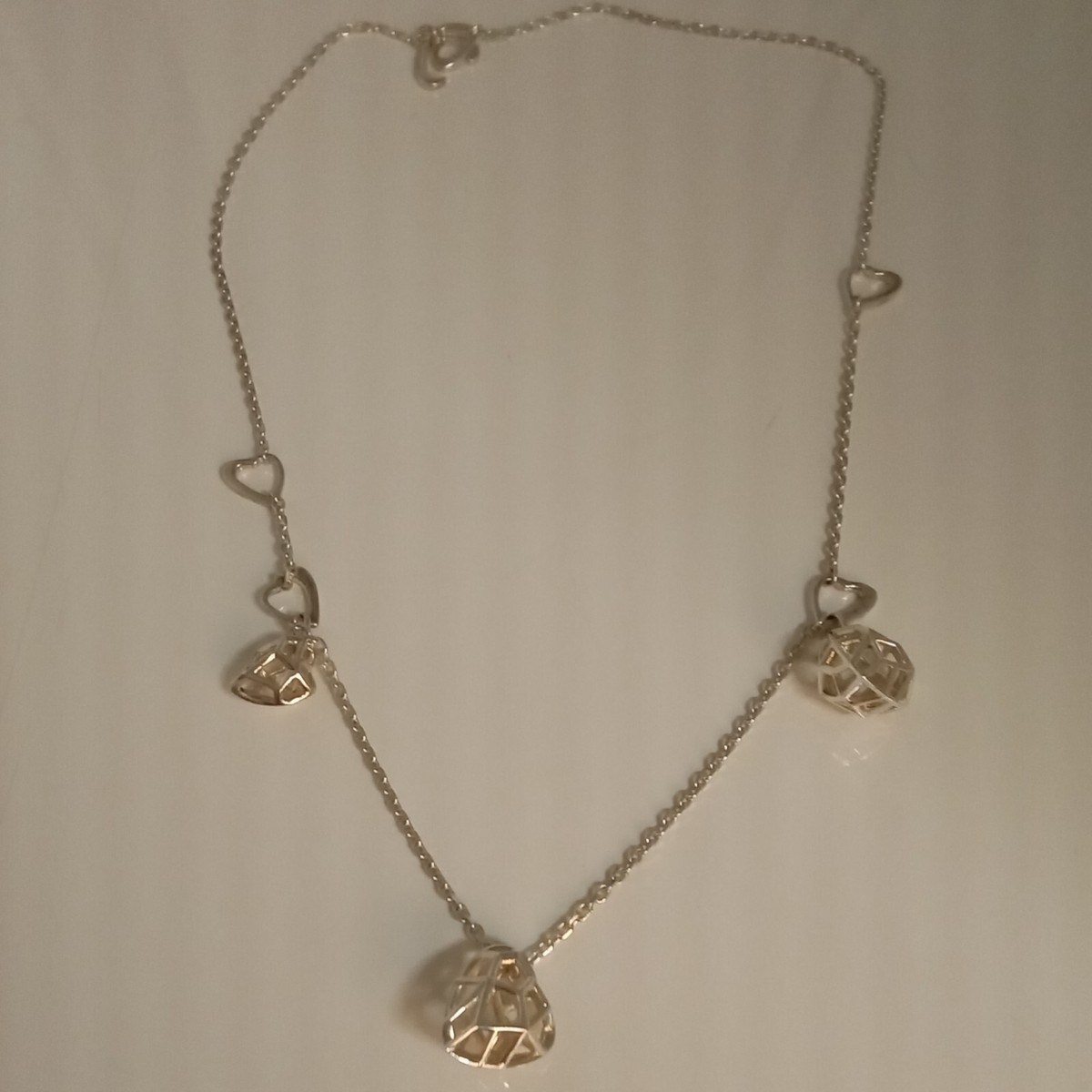 Links of London Flutter and Wow necklace caged hearts pendant