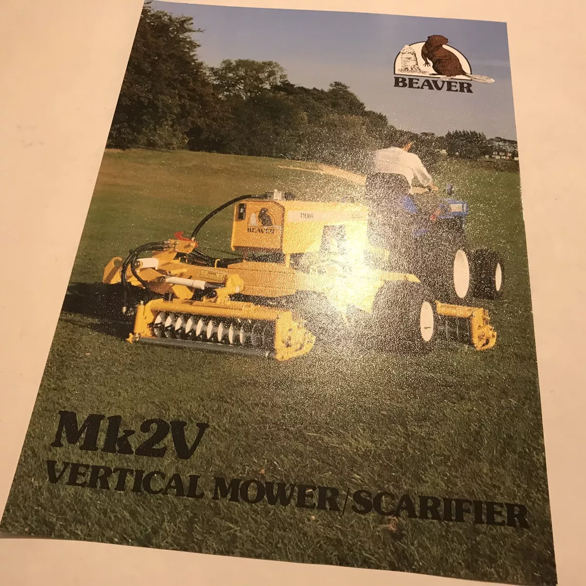 Hayter scarifier outlet