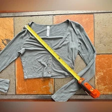 Gray woman’s alo medium ribbed whisper long sleeve cropped button v neck top