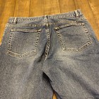 Blue Theory jeans men’s 30x33 with button fly closure, back pockets, and faded stretch denim design on light wood floor.