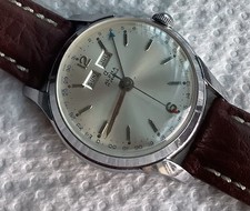 Montre ancienne Alpha GMT triple date 