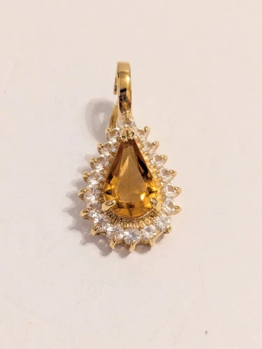 VETEMENTS Set punte a goccia tono oro topazio vetro e strass ciondolo rimovibile. 1 25"