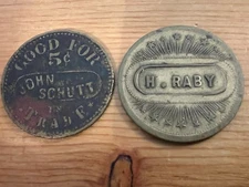 "RABY and SCHUTT" (a pair of maverick saloon tokens) WEST BAY CITY, MICHIGAN