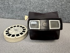 Vintage 1950  s View-Master Model C Bakelite viewer with a stack of 3D reels.