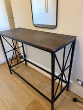 Wooden console table with metal frame and legs. Industrial look.