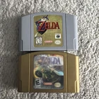 Zelda Majoras Mask and Ocarina of Time Nintendo 64 Holographic Gold Authentic
