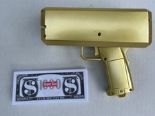 Make It Rain Money Machine Cash Super Gun Shoots Out Replica Bills GOLD