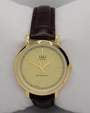 Reloj analógico con correa de cuero marrón esfera dorada tono dorado QQ para dama K5