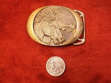 ARTISTIC VTG 1982 SOLID BRASS WESTERN BELT BUCKLE WITH DOUBLE HORSE HEAD PROFILE