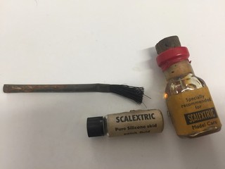 1960's scalextric paper skid oil and engine oil with brush