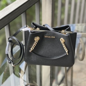 teagen small pebbled leather messenger bolsa