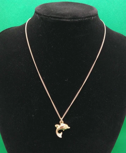Collier dauphin CHRISTIAN DIOR avec quelques petites rayures du Japon