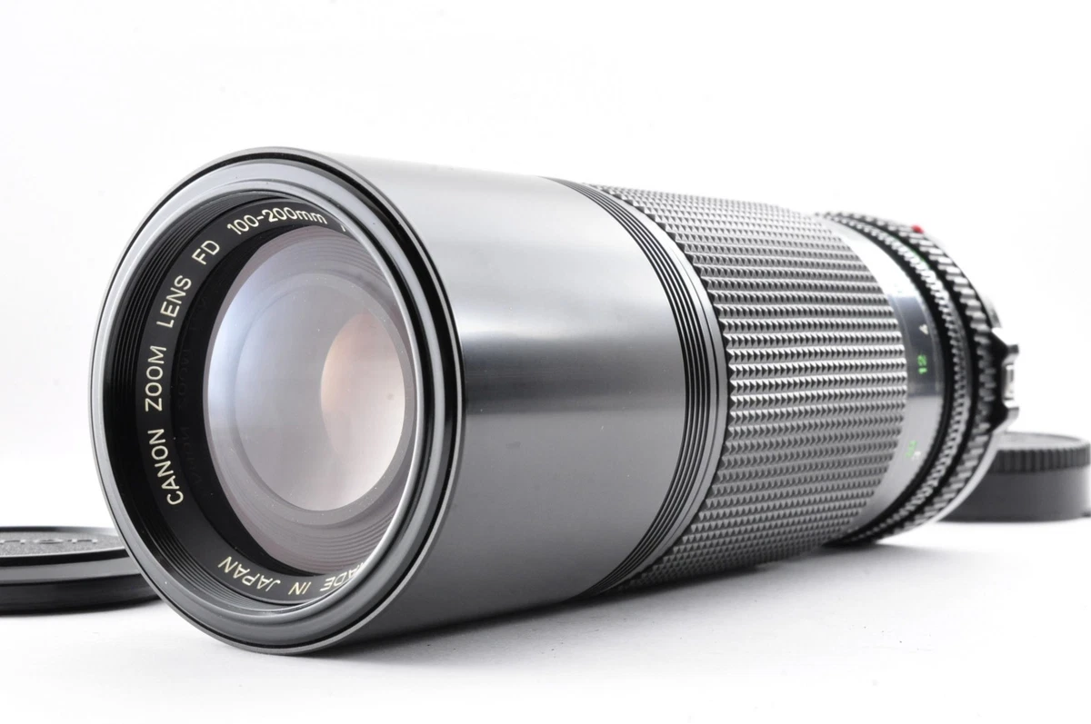 Objectif zoom Canon FD 100-200 mm vintage avec bouchon d