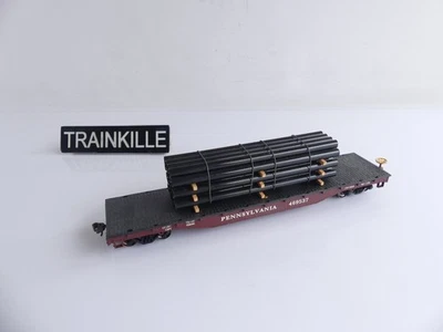 EVEMODEL HO WAGON PLAT A BOGIES TYPE US + CHARGEMENT TUYAU NOIRS - Photo 1/2