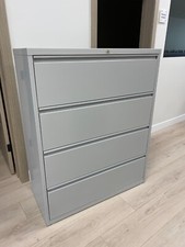 metallic file cabinet 4 drawer with a lock , grey color , brand new