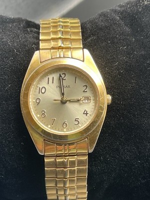  Pulsar Watch Women Gold Stainless Stretch Water Res Champagne Date Batt Quartz