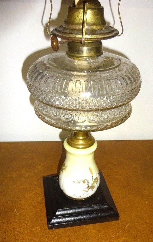 antique Victorian glass or porcelain center cast iron base kerosene lamp