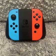 Par Joy-Con Nintendo Switch rojo neón y azul neón con empuñadura Joy-Con OEM
