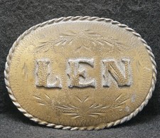 XA03177 AWESOME VINTAGE 1981  LEN  NAME FASHION ARTWORK MENS BRASS BELT BUCKLE