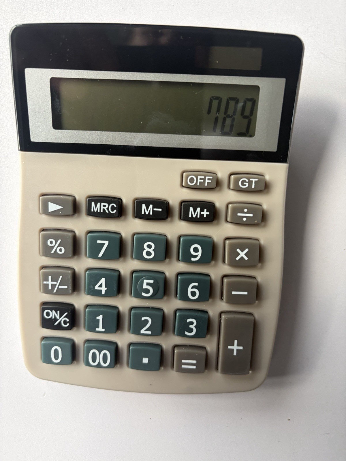 Desktop dual powered solar/battery calculator with memory function.