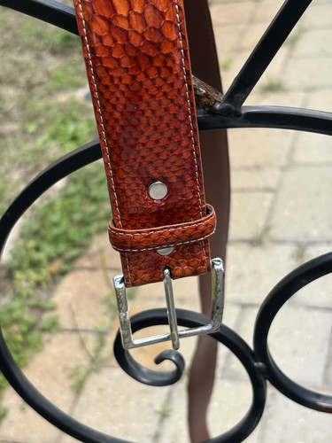 Brown leather belt with white stitching, silver belt buckle, and textured calf leather design, made in USA.