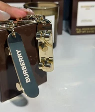 Burberry Gold-Tone Metal Skateboard Keychain / Key Ring – Logo Engraved