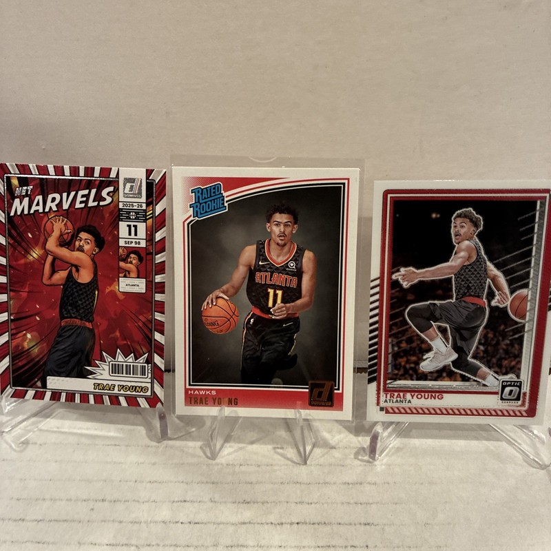 2018-19 Panini Donruss -Trae Young #198 (RC) and 2025 Optic/ Marvel Card