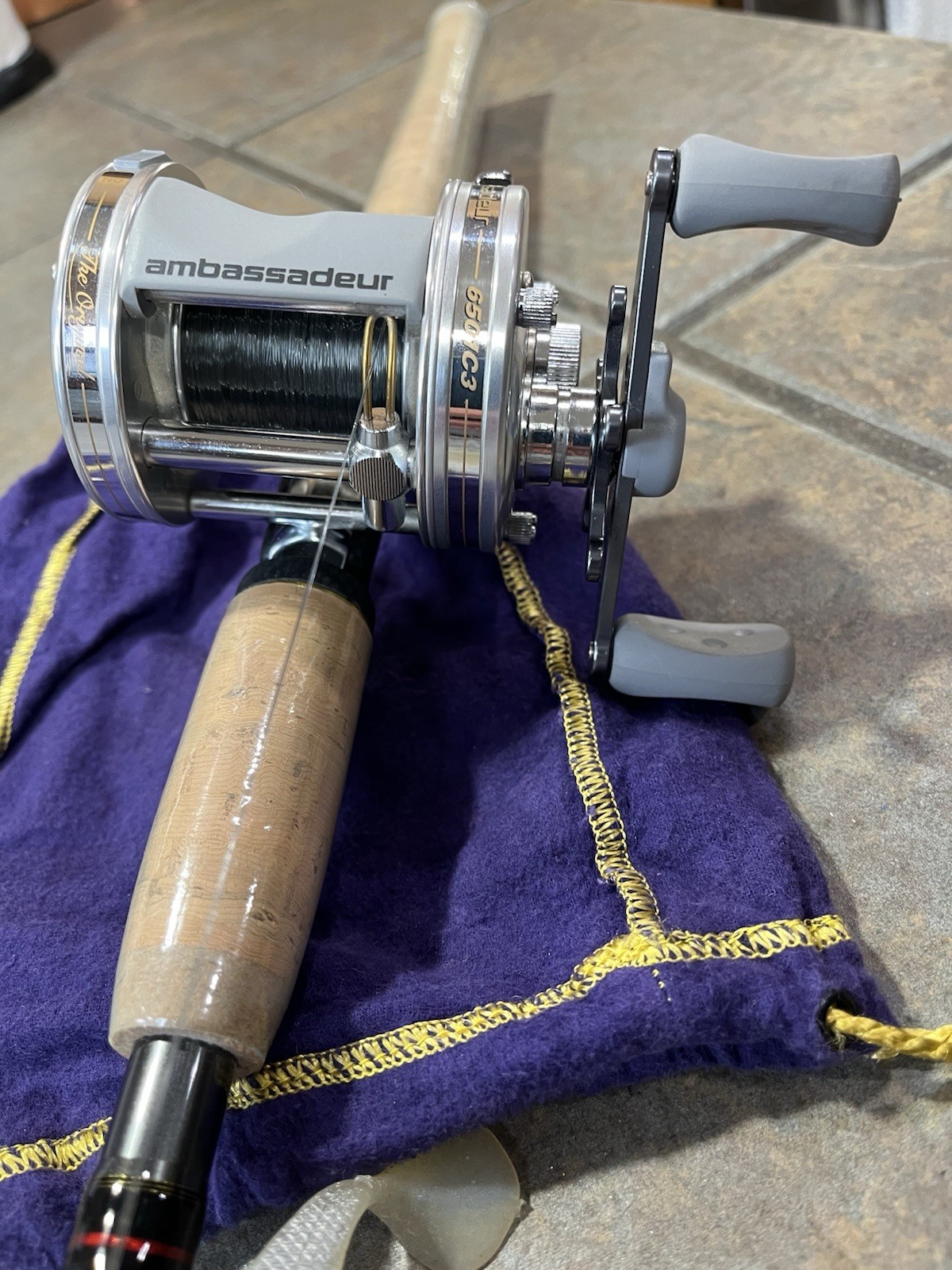 Mint- Abu Garcia Ambassadeur- 6501C3- Metallic Silver- Left 
