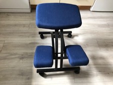 Padded posture stool for a desk . Excellent condition. Upholstery is blue.