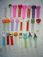 PEZ COLLECTION OF 24-SOME NO FEET-- PERFECT GIFT FOR THE COLLECTOR