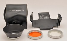 POLAROID TRIPOD MOUNT 111, LENS SHADE, TWO FILTERS, AND KIT CASE