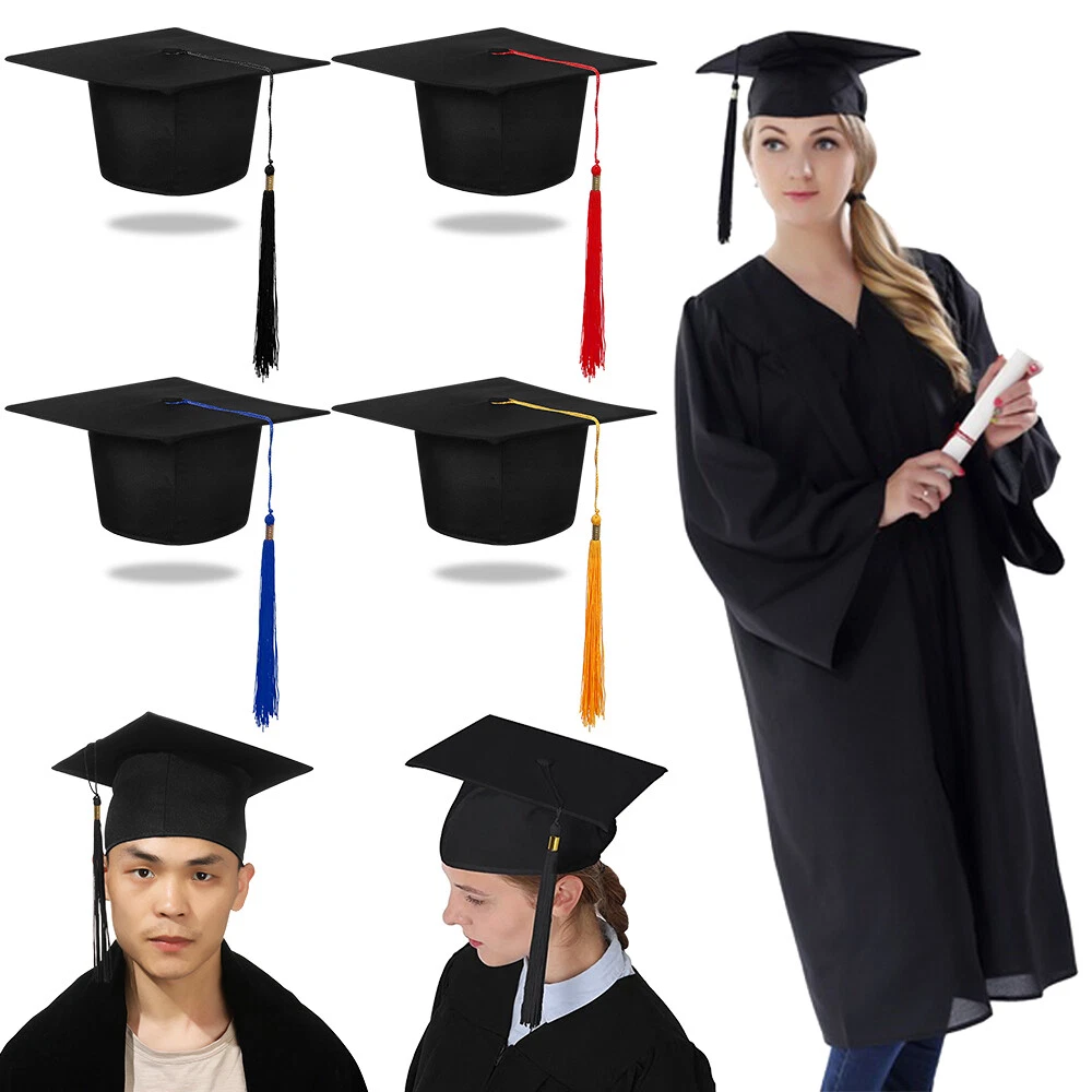 Surprised young brunette woman in graduation gown and mortarboard isolated  on white Stock Photo by LightFieldStudios