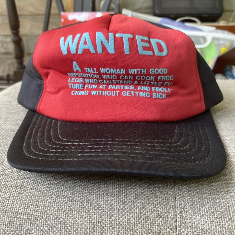Actual vintage 80s novelty snapback with a cheeky 'Woman Wanted' slogan — a wearable time capsule of questionable retro humor.